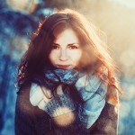 content brunette woman in the sunshine and snow