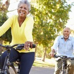 retired man and woman on bikes
