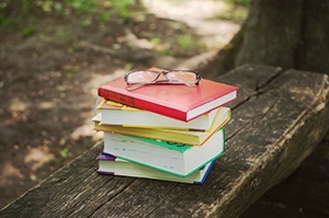 Stack of books with reading glassess