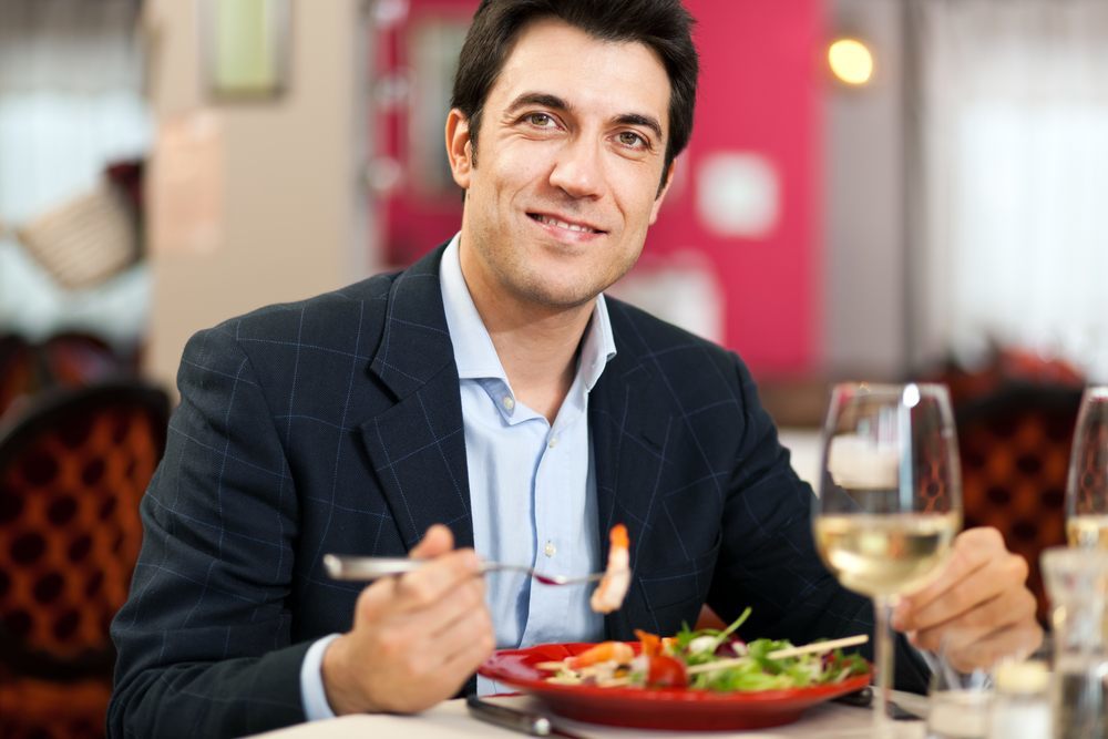 a man eating a salad 