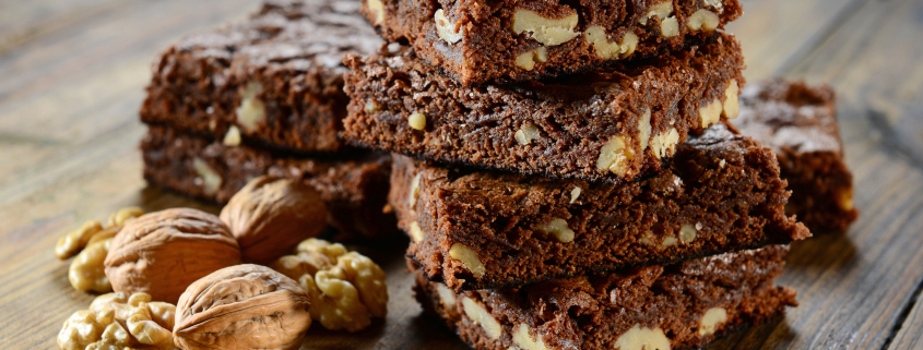 black bean brownies stacked with a walnut