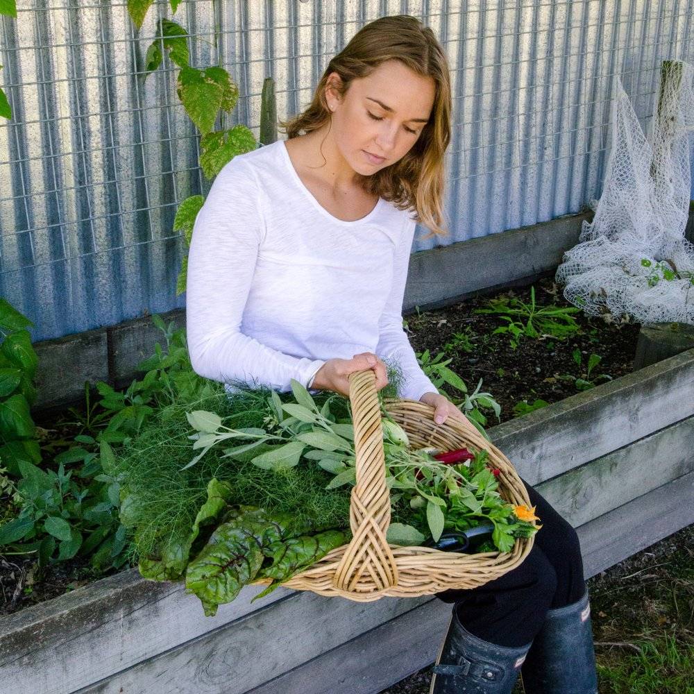 Lady holding fresh vegetables, seen during in New Zealand Adventure Trek by Mountain Trek