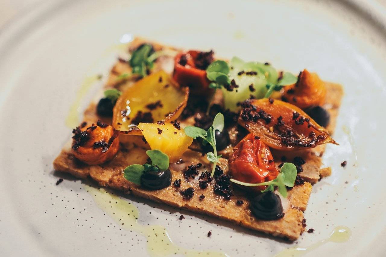 flatbread pizza on a plat at Rata Restaurant in New Zealand