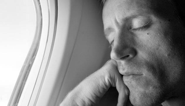 man-sleeping-on-a-plane